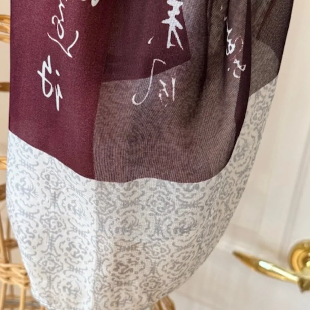 100% silk wine colored and silver oblong scarf.